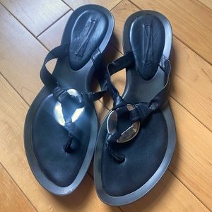 Black Nine West sandals with silver medallion detail